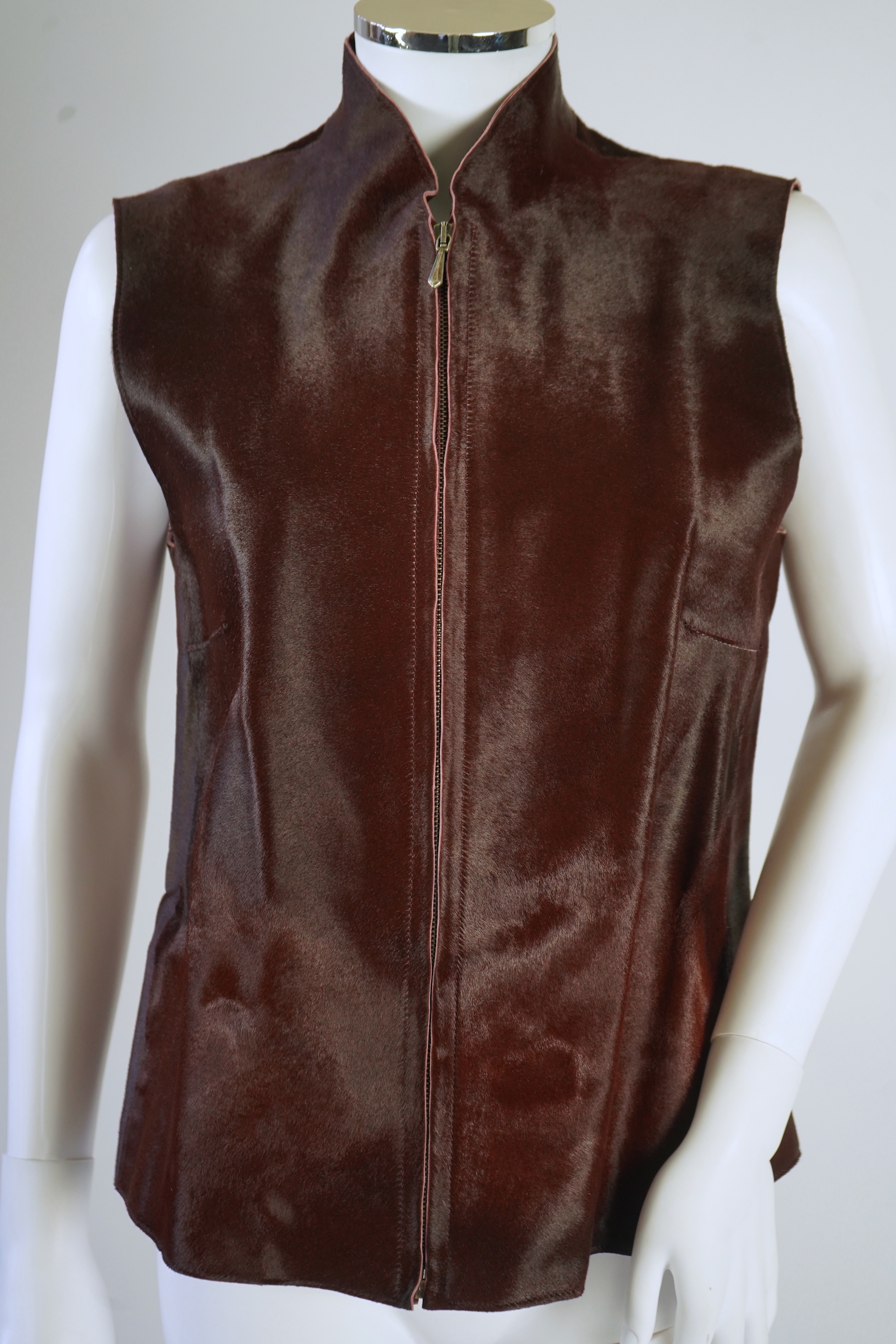 A lady's Jaeger brown ponyskin gilet with burgundy satin lining. UK 12-14